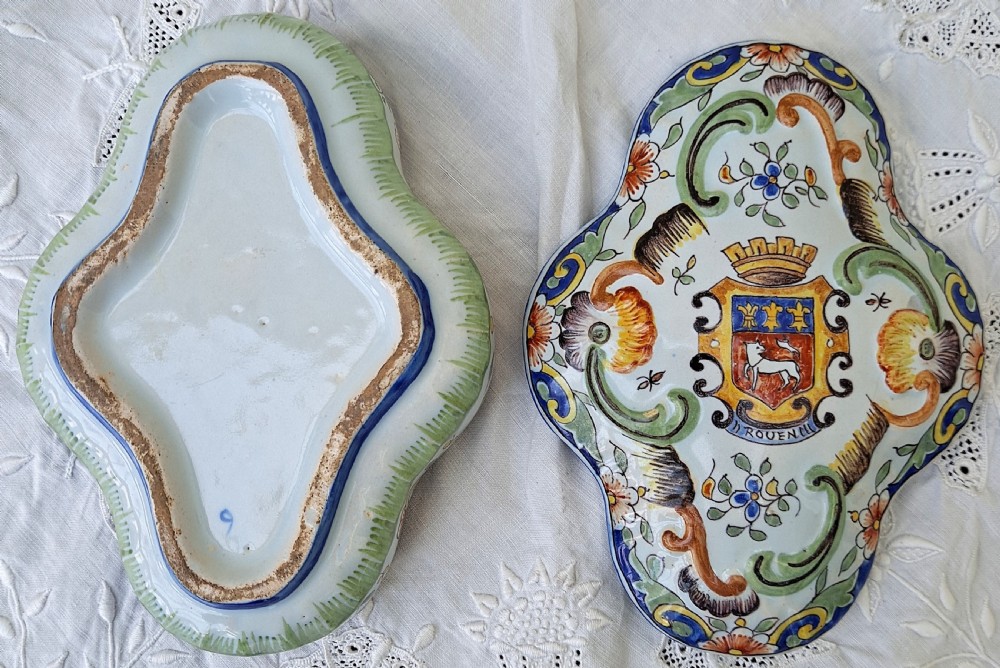 A shaped hand-painted French faience lidded trinket box with polychrome scroll and floral decoration on an off-white glaze. View V