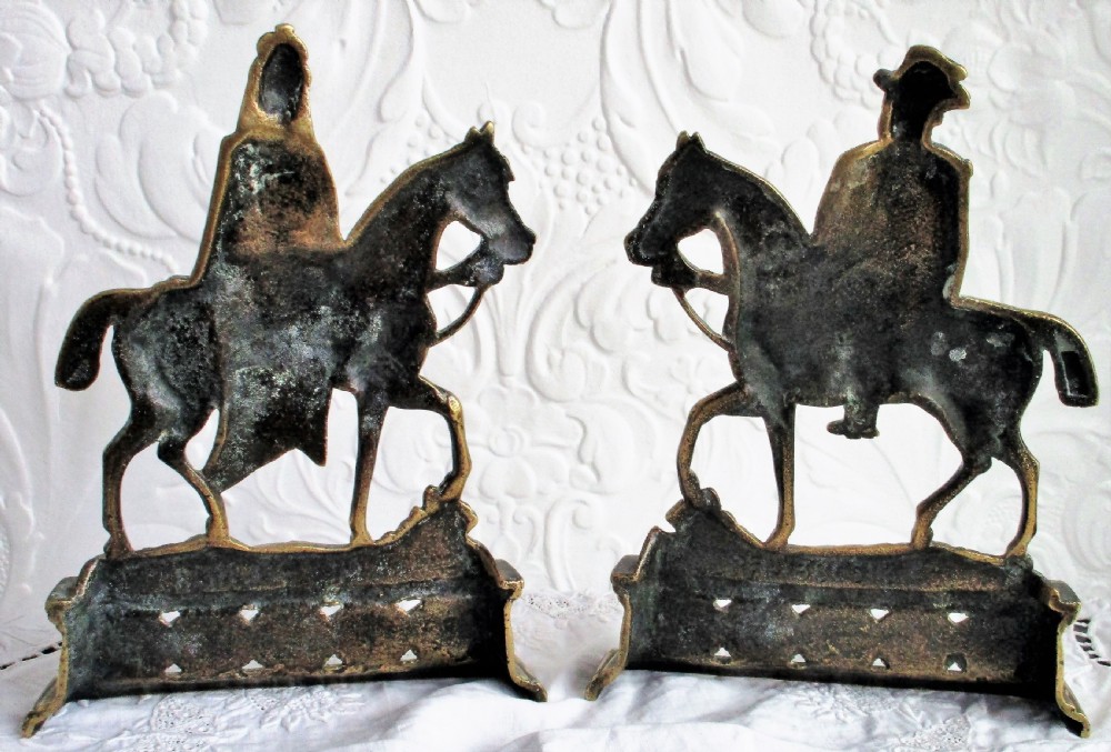 A pair of antique cast brass equestrian figures depicting King Edward VII and Queen Alexandra set on decorative plinth bases. View VI