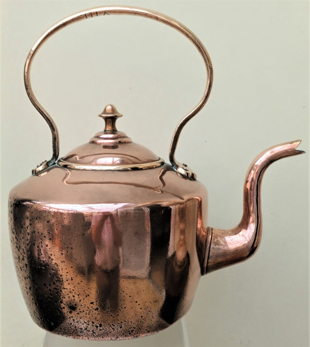 An antique Victorian copper kettle featuring a gooseneck spout, a fixed overhead loop handle, and a domed lid topped with a brass finial. View III