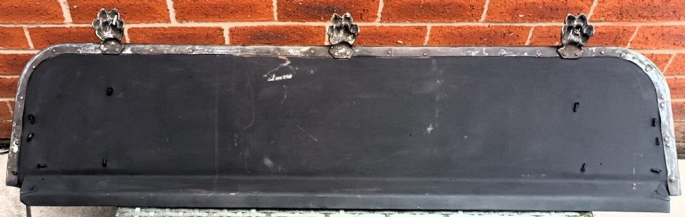 A Victorian pierced brass fireplace fender with central rope-twist moulding, pierced fretwork bands, and cast paw feet. View X