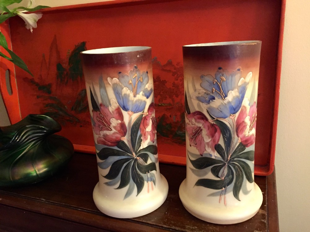 A pair of cylindrical Art Nouveau opaline glass vases with flared bases, decorated with hand-painted blue and pink floral enamel designs and dark gradient rims. View III