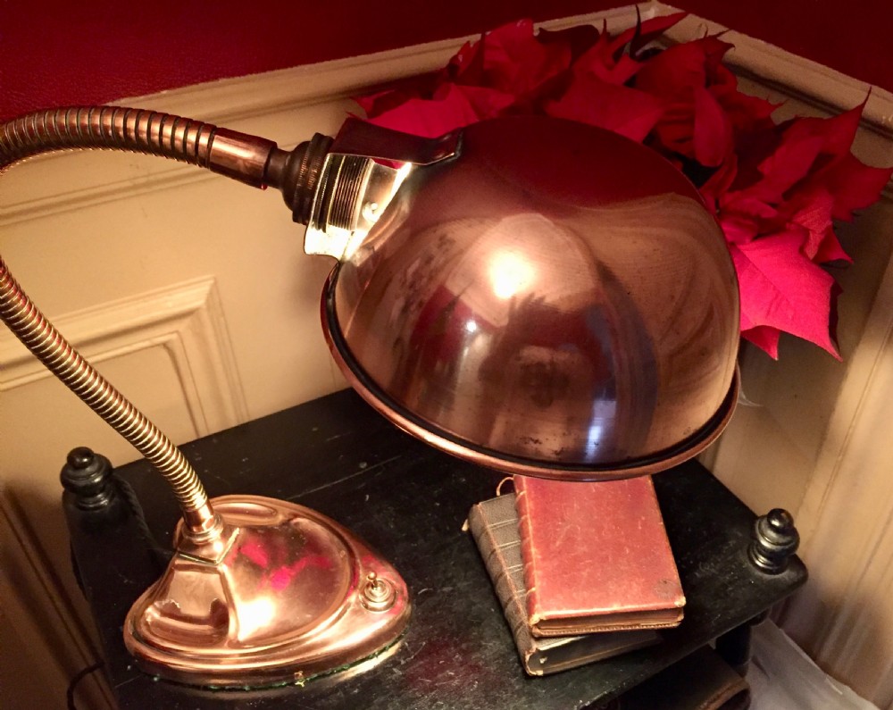 An Edwardian copper desk lamp featuring a hemispherical dome shade, a flexible gooseneck arm, and a molded base with an integrated switch. View II