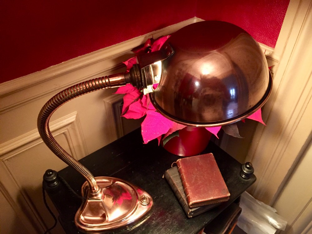 An Edwardian copper desk lamp featuring a hemispherical dome shade, a flexible gooseneck arm, and a molded base with an integrated switch. View III