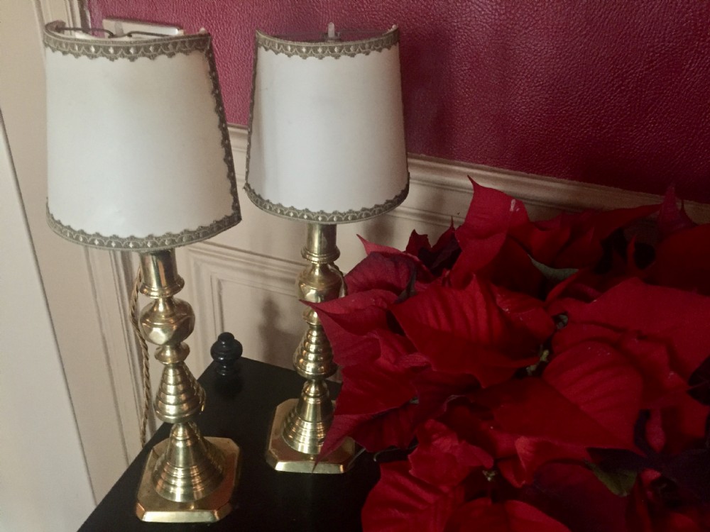 A pair of turned brass table lamps designed in the style of Georgian candlesticks with stepped square bases. View VIII