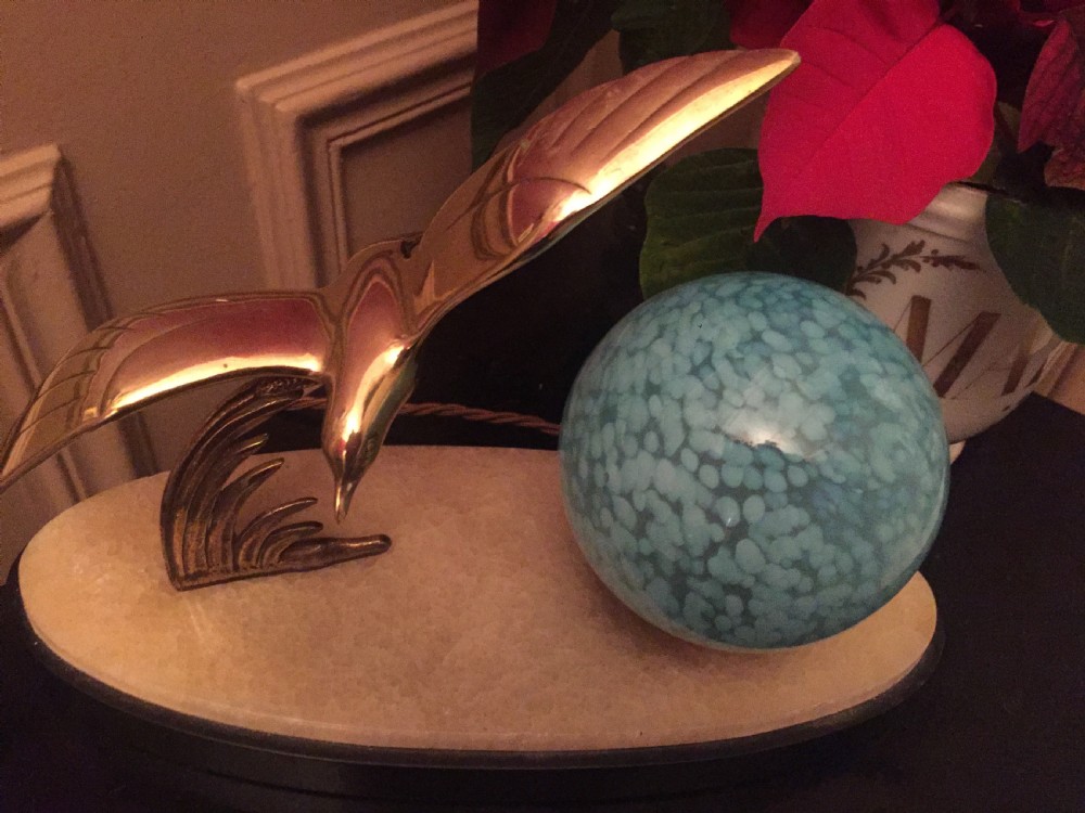 An Art Deco night light featuring a polished brass seagull sculpture and a frosted spherical glass shade mounted on an oval marble base. View II