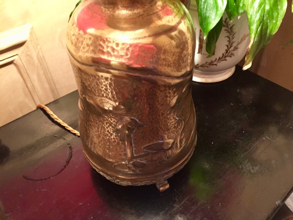 An antique bronze oil lamp featuring an embossed metal base with a side handle, a pierced gallery, and an etched glass globe shade. View VI