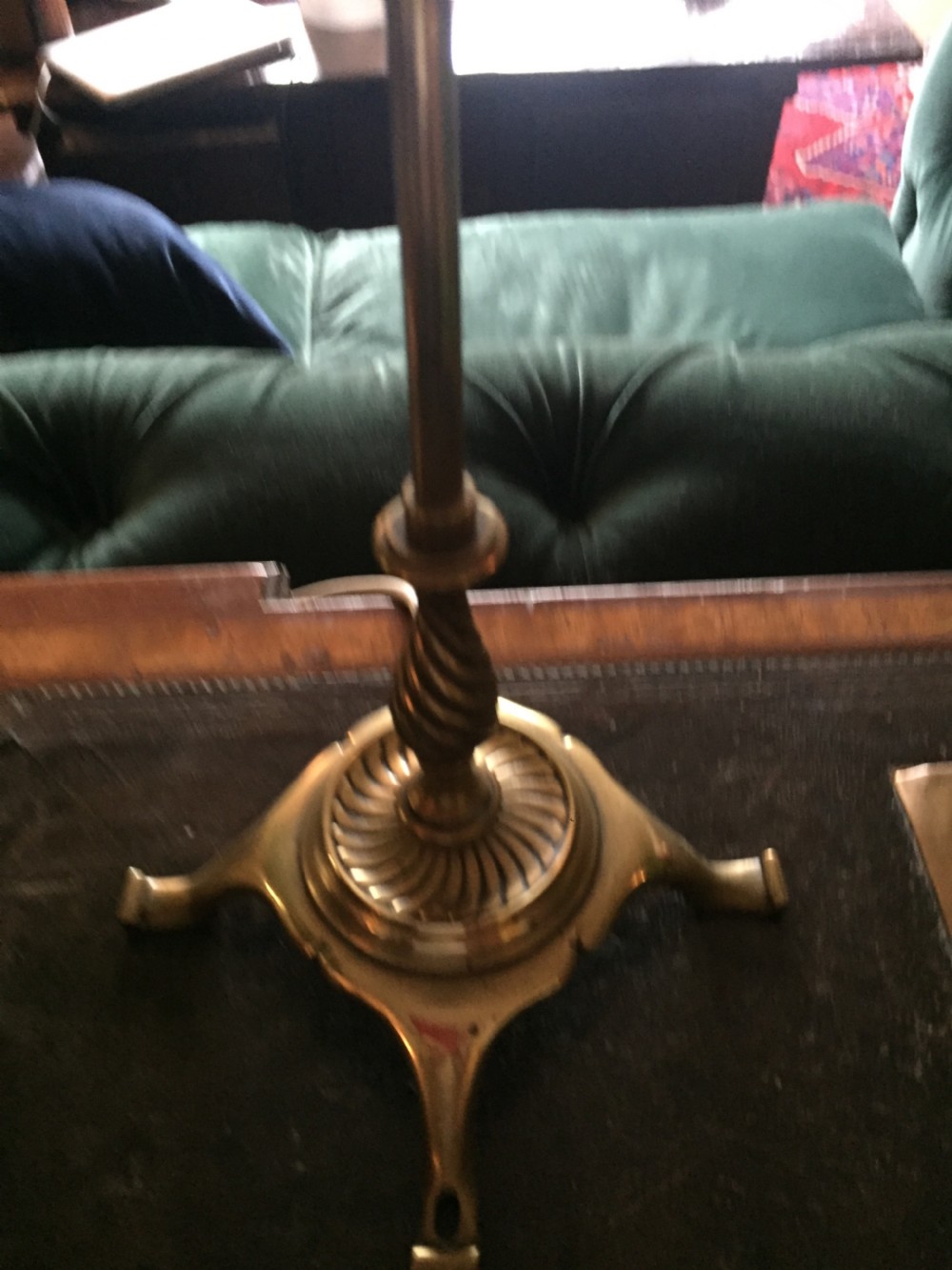 An Edwardian brass table lamp featuring a tripod base, a twisted column stem, and a faceted white opaline glass shade. View VII