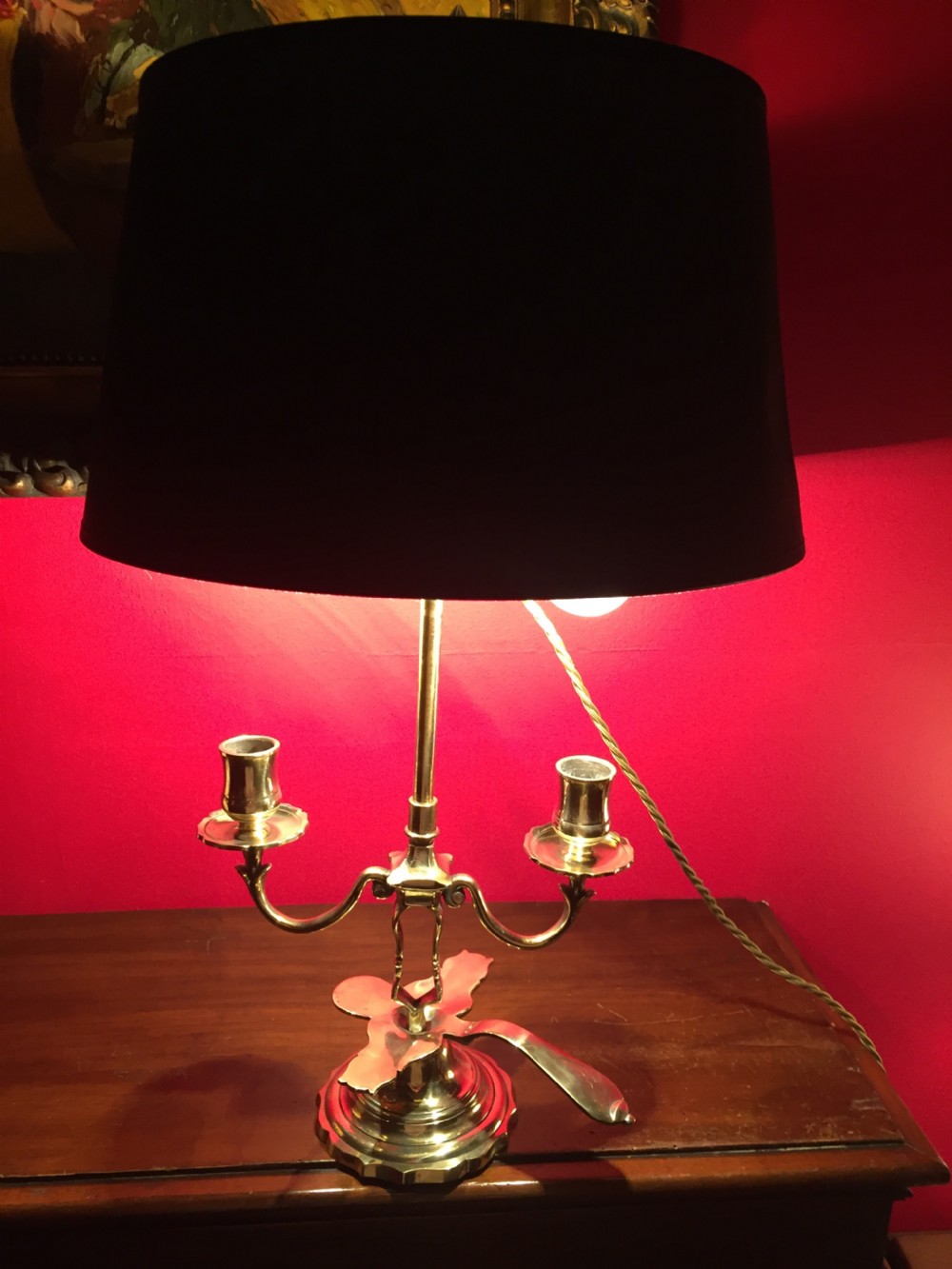An antique French brass desk lamp with twin candlestick arms and a dark rounded lampshade. View III