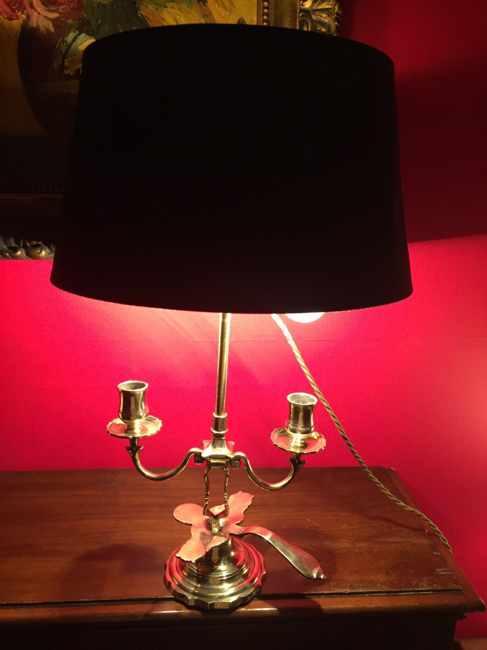 An antique French brass desk lamp with twin candlestick arms and a dark rounded lampshade. View IV