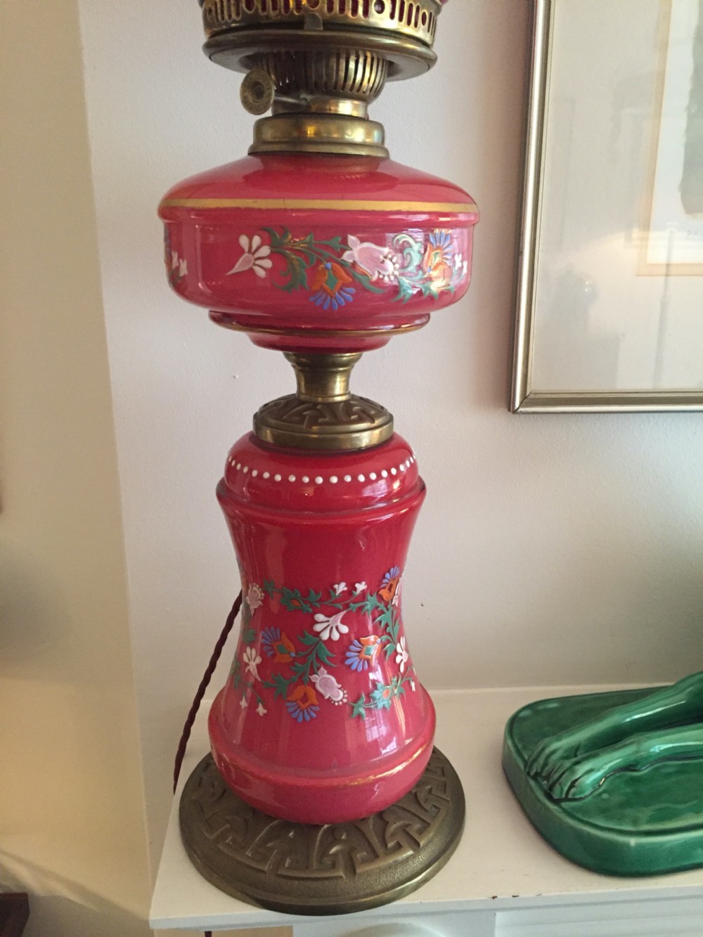 An Art Nouveau table lamp featuring a pink enamelled faience ceramic column with floral motifs, bronze mounts, and a matching pink glass globe shade. View III