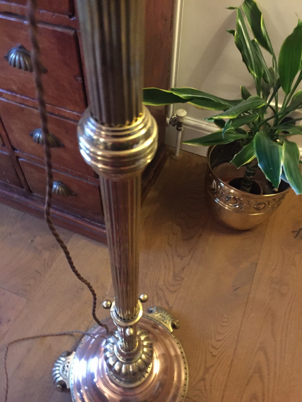 A Victorian telescopic standard lamp with a fluted brass column, height adjustment collar, and a polished copper domed base supported by cast metal feet. View X