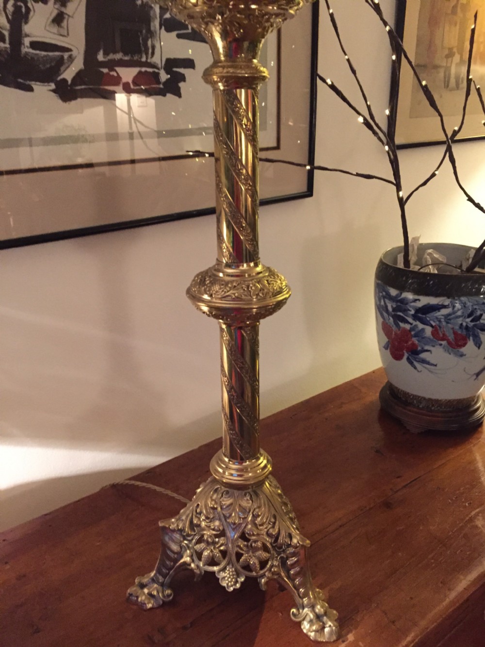 A 19th-century French brass altar candlestick converted into a table lamp, featuring an ornate tri-form base and a spiral-fluted column. View VIII