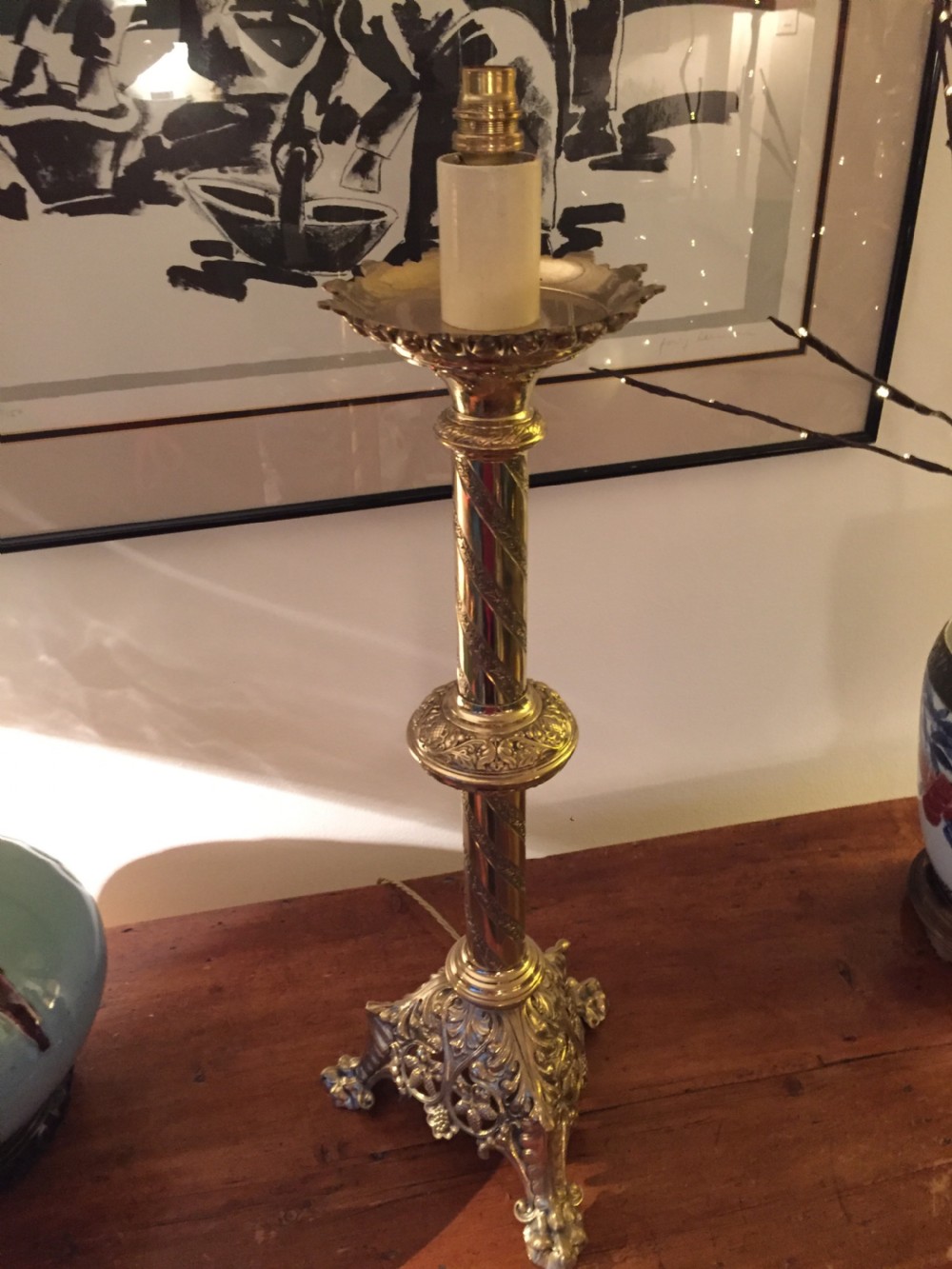 A 19th-century French brass altar candlestick converted into a table lamp, featuring an ornate tri-form base and a spiral-fluted column. View XI