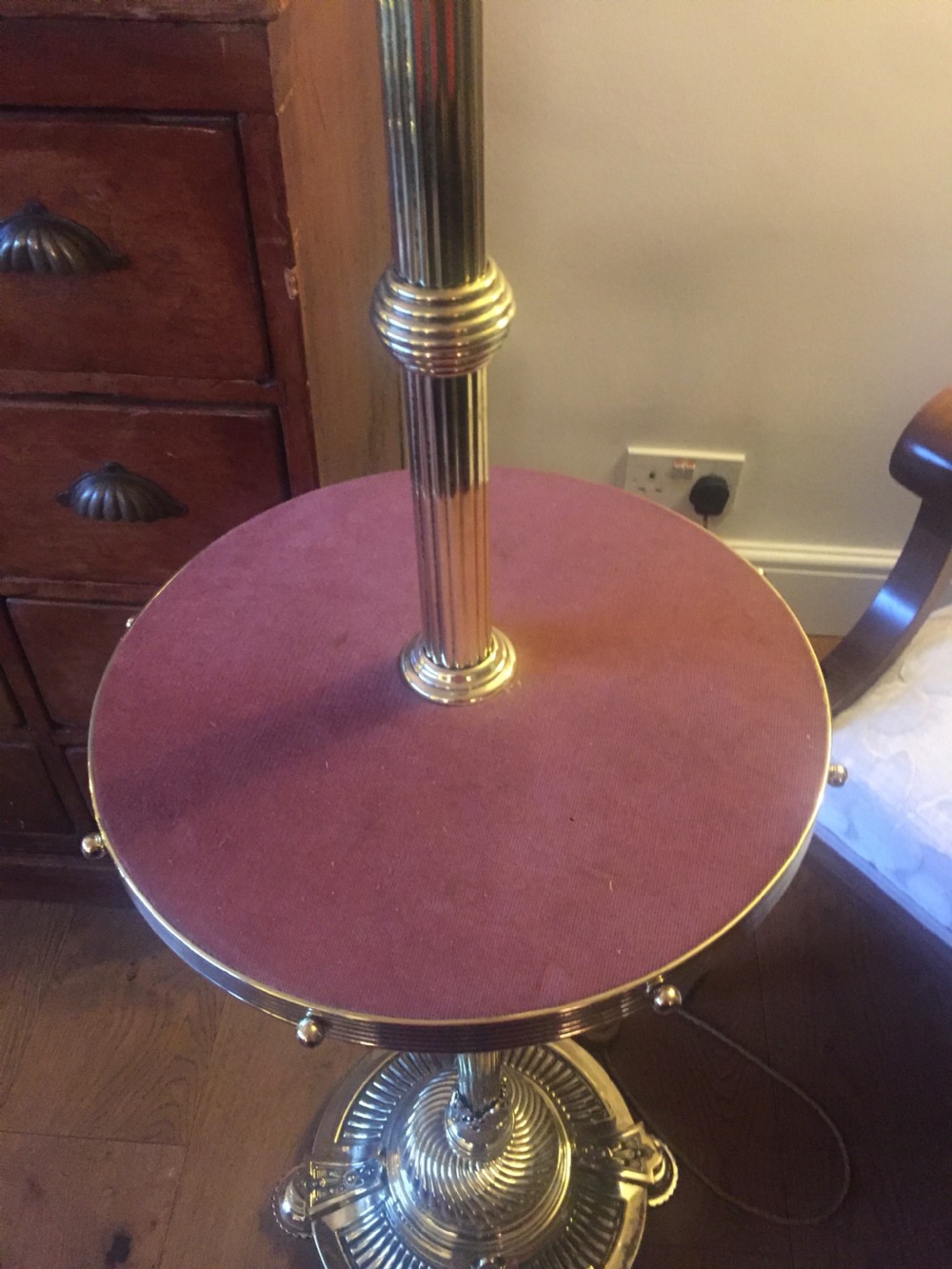 An antique Victorian telescopic standard lamp crafted in polished brass featuring an adjustable stem, a mid-tier pink felt circular tray, and a gadrooned circular base. View XII