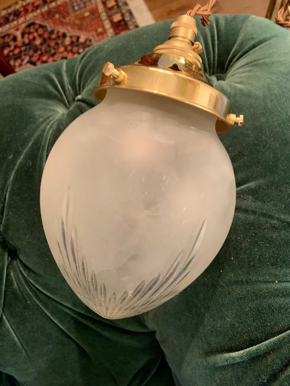An Edwardian period frosted glass pendant lantern featuring cut leaf details at the base and a polished brass top gallery. View V