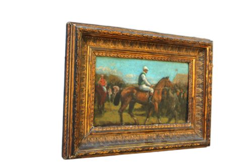 fig 6. An early 20th-century impressionistic oil painting of a mounted jockey on a bay racehorse in a paddock, framed in a carved gilded wooden frame.