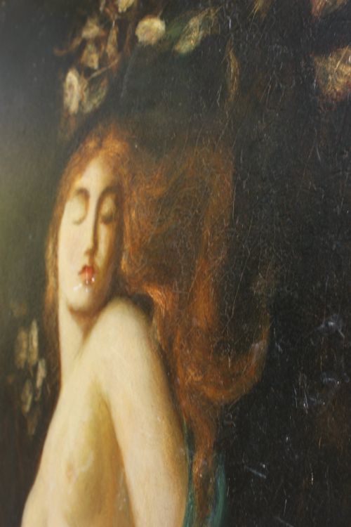 fig 7. A large vertical Pre-Raphaelite oil painting depicting a knight in armour gazing up at a woman, set within an ornate carved gilt frame.