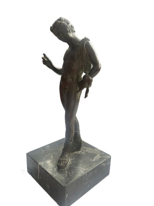 fig 1. A 19th-century Neapolitan dark patinated bronze statue of Narcissus set upon a square black fossil marble base.