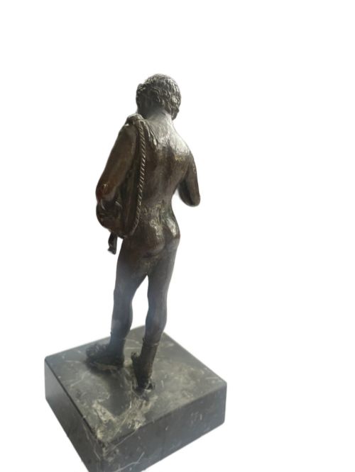 fig 2. A 19th-century Neapolitan dark patinated bronze statue of Narcissus set upon a square black fossil marble base.