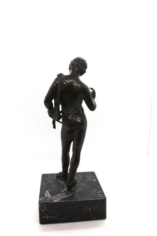 fig 3. A 19th-century Neapolitan dark patinated bronze statue of Narcissus set upon a square black fossil marble base.