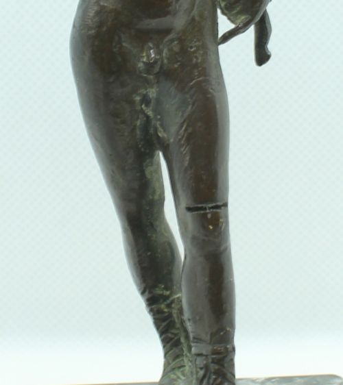 fig 4. A 19th-century Neapolitan dark patinated bronze statue of Narcissus set upon a square black fossil marble base.