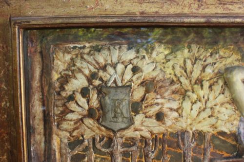 fig 3. A rectangular Arts and Crafts polychrome plaster relief featuring a central classical figure framed by trees and inscribed Ave Epicurus within a gilt frame.