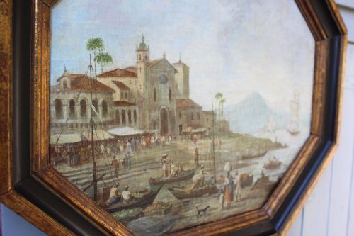 fig 4. An early nineteenth-century octagonal oil painting depicting a harbour scene in Rio de Janeiro, housed in a moulded gilt and ebonised wooden frame.