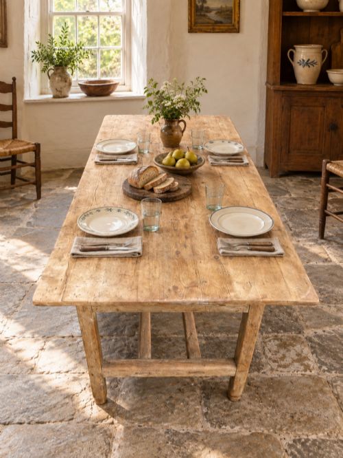 fig 5. A 19th century rectangular Irish pine farmhouse table featuring square legs, lower H-stretchers, and a warm timber finish.