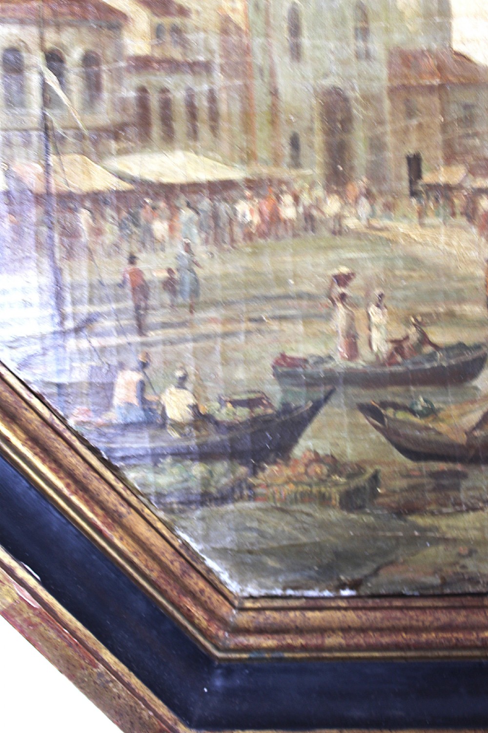 An octagonal framed early 19th-century oil painting depicting a Brazilian coastal landscape with colonial buildings, figures along the shore, and boats on the water. View XIII