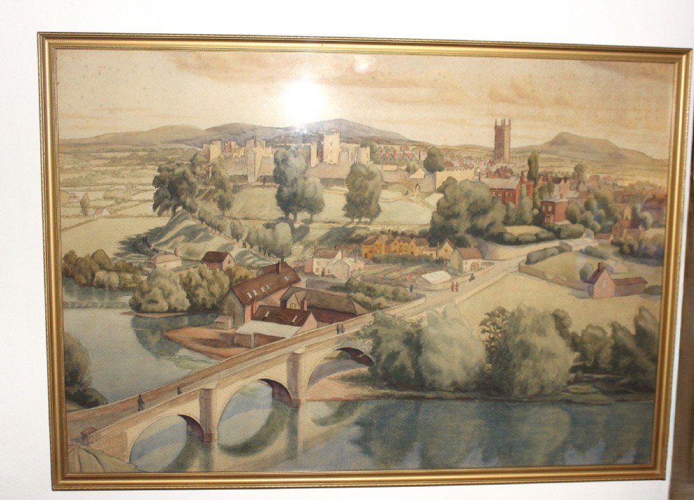 A framed 1930s watercolour painting depicting Dinham Bridge crossing a river with Ludlow Castle and town visible on the hill in the background.