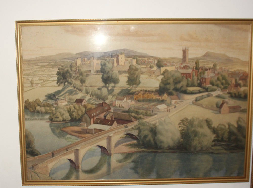 A framed 1930s watercolour painting depicting Dinham Bridge crossing a river with Ludlow Castle and town visible on the hill in the background. View III