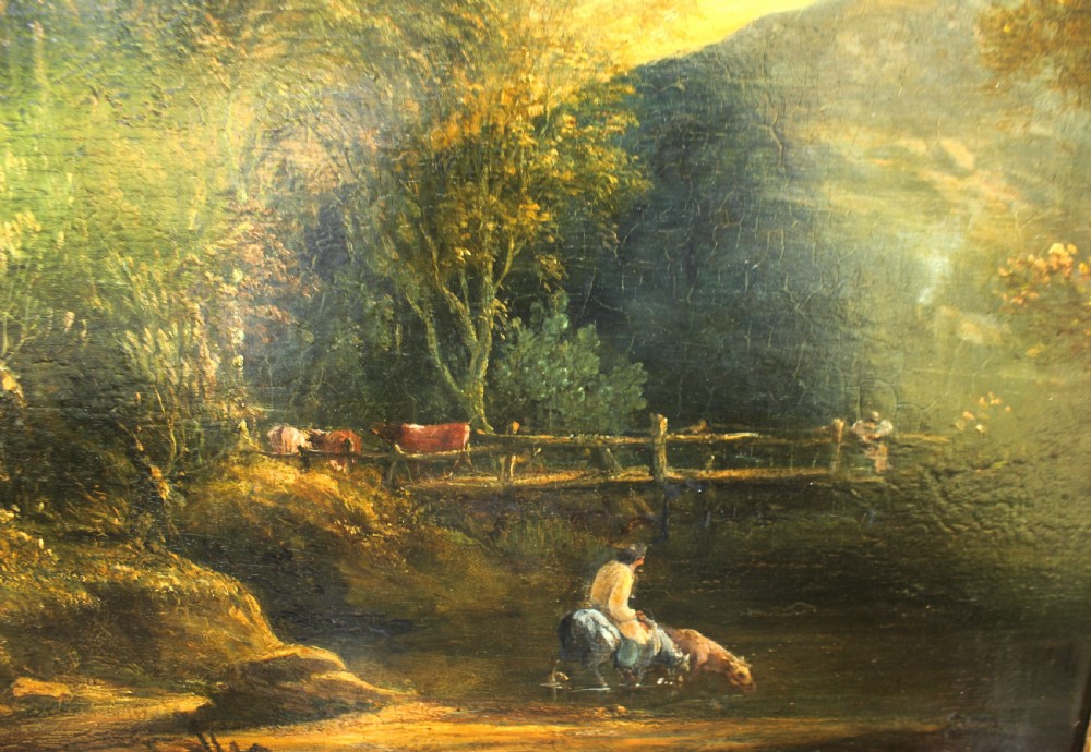 A 19th-century English pastoral oil painting depicting trees, hills, and figures beside a body of water in a moulded gilt frame. View IV