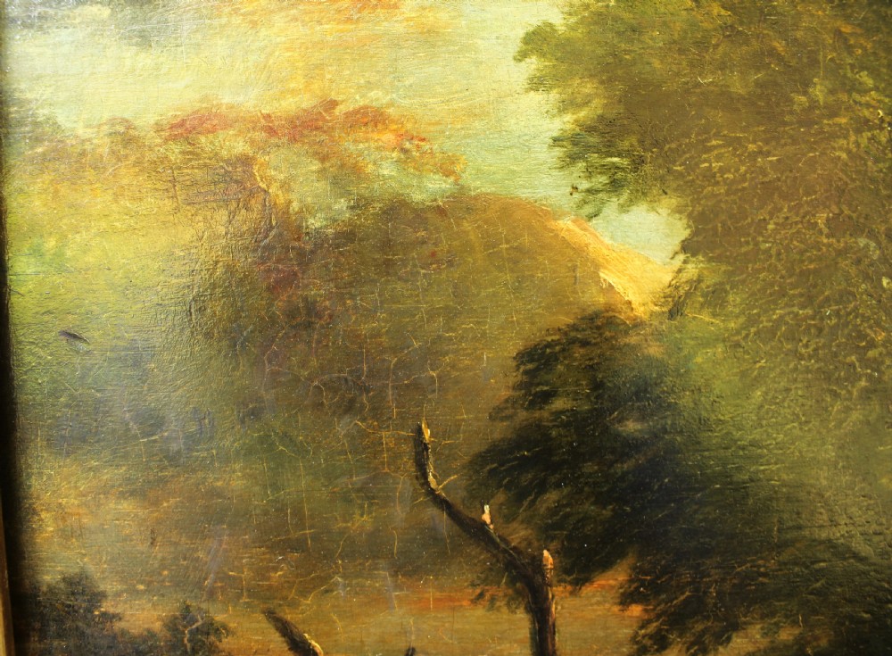 A 19th-century English pastoral oil painting depicting trees, hills, and figures beside a body of water in a moulded gilt frame. View VIII