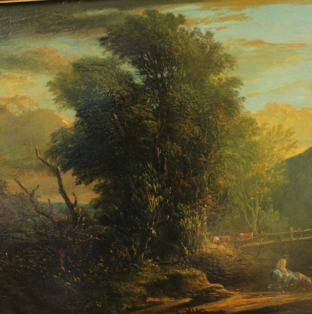A 19th-century English pastoral oil painting depicting trees, hills, and figures beside a body of water in a moulded gilt frame. View IX