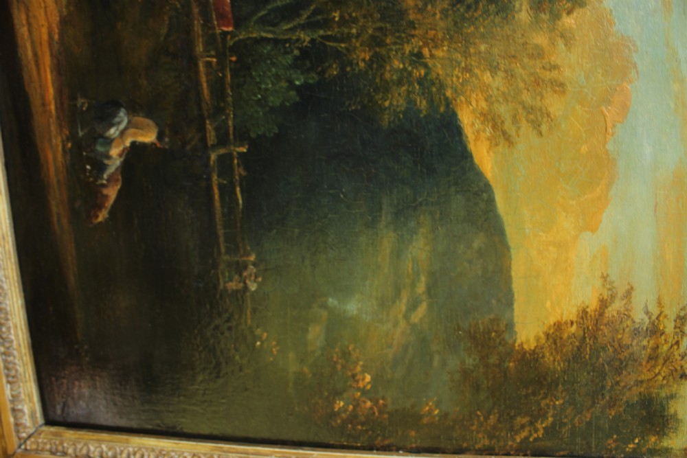 A 19th-century English pastoral oil painting depicting trees, hills, and figures beside a body of water in a moulded gilt frame. View X
