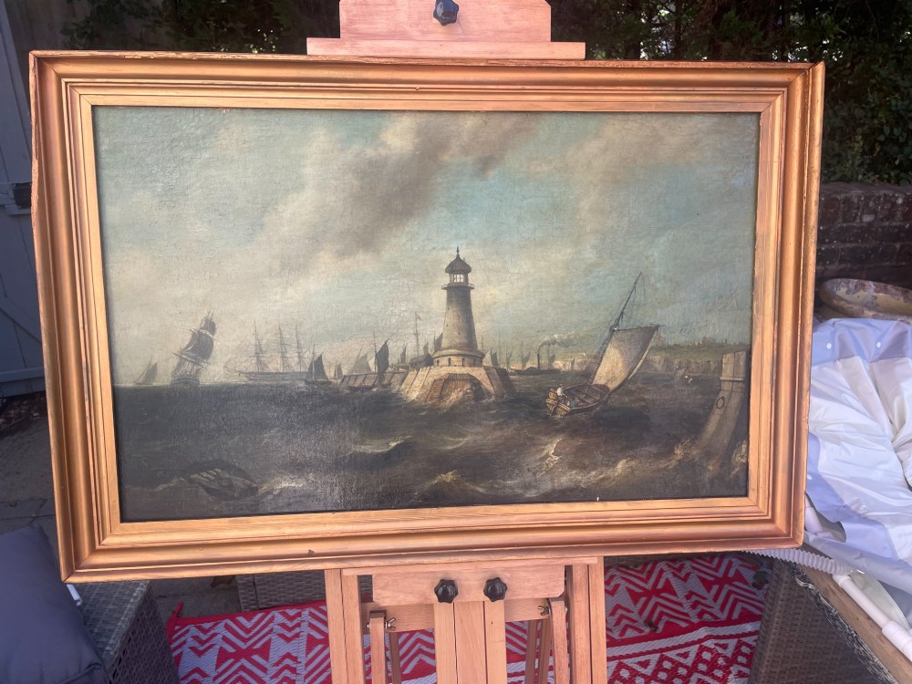 A 19th-century maritime oil painting in a gilt frame depicting Plymouth Breakwater Lighthouse and Royal Navy ships on turbulent seas. View V