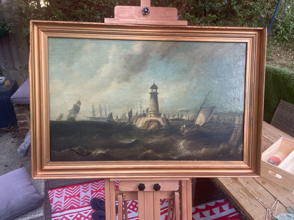 A 19th-century maritime oil painting in a gilt frame depicting Plymouth Breakwater Lighthouse and Royal Navy ships on turbulent seas. View XII