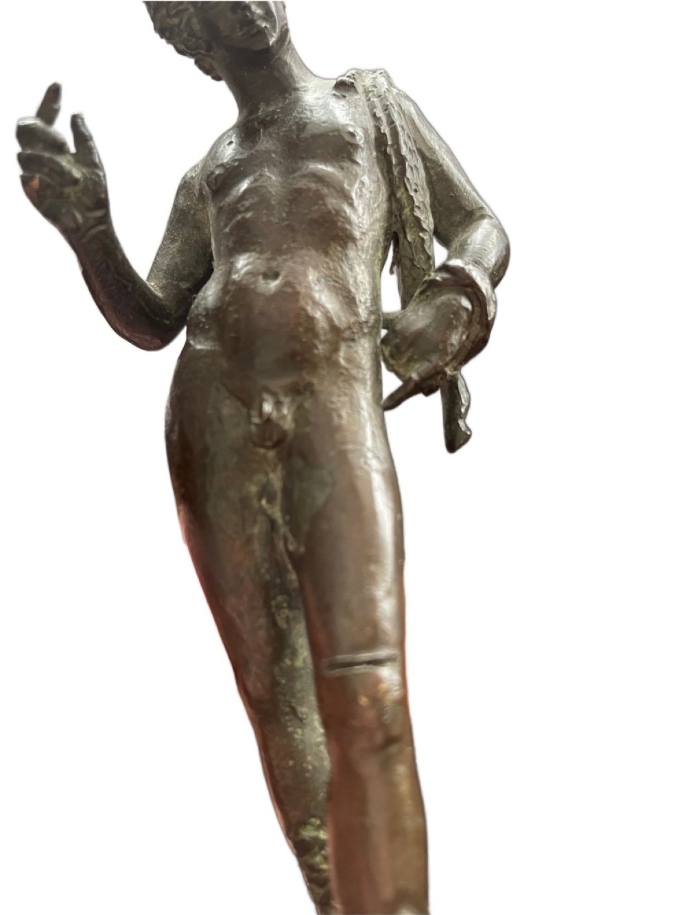 A 19th-century Neapolitan dark patinated bronze statue of Narcissus set upon a square black fossil marble base. View VI
