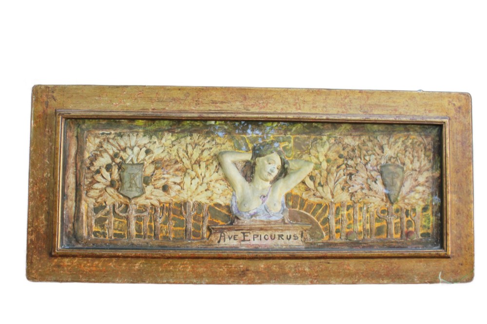 A rectangular Arts and Crafts polychrome plaster relief featuring a central classical figure framed by trees and inscribed Ave Epicurus within a gilt frame.