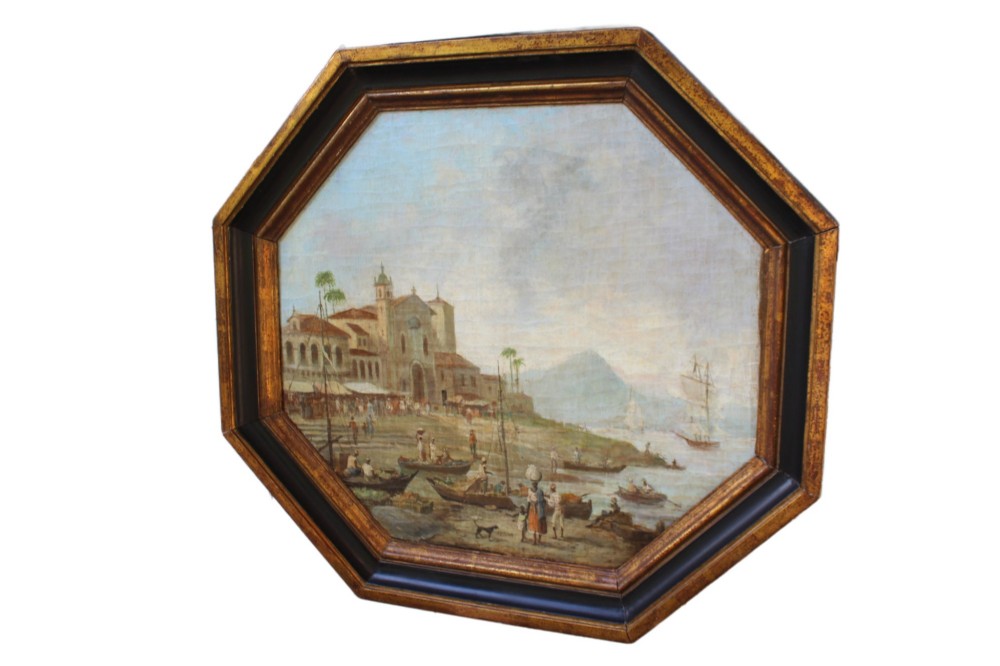 An early nineteenth-century octagonal oil painting depicting a harbour scene in Rio de Janeiro, housed in a moulded gilt and ebonised wooden frame. View II