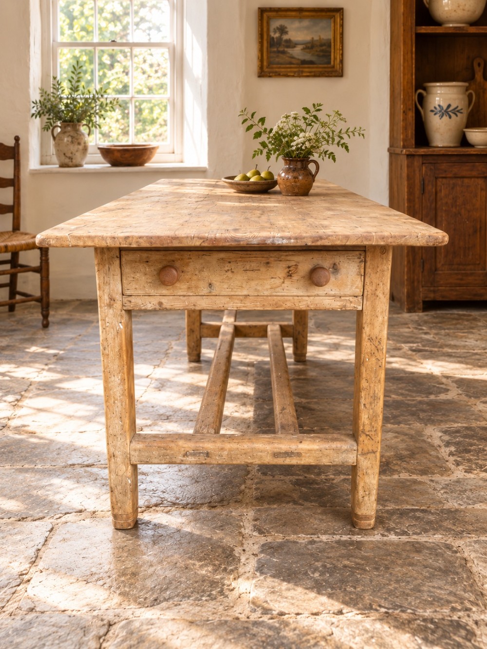 A 19th century rectangular Irish pine farmhouse table featuring square legs, lower H-stretchers, and a warm timber finish. View II