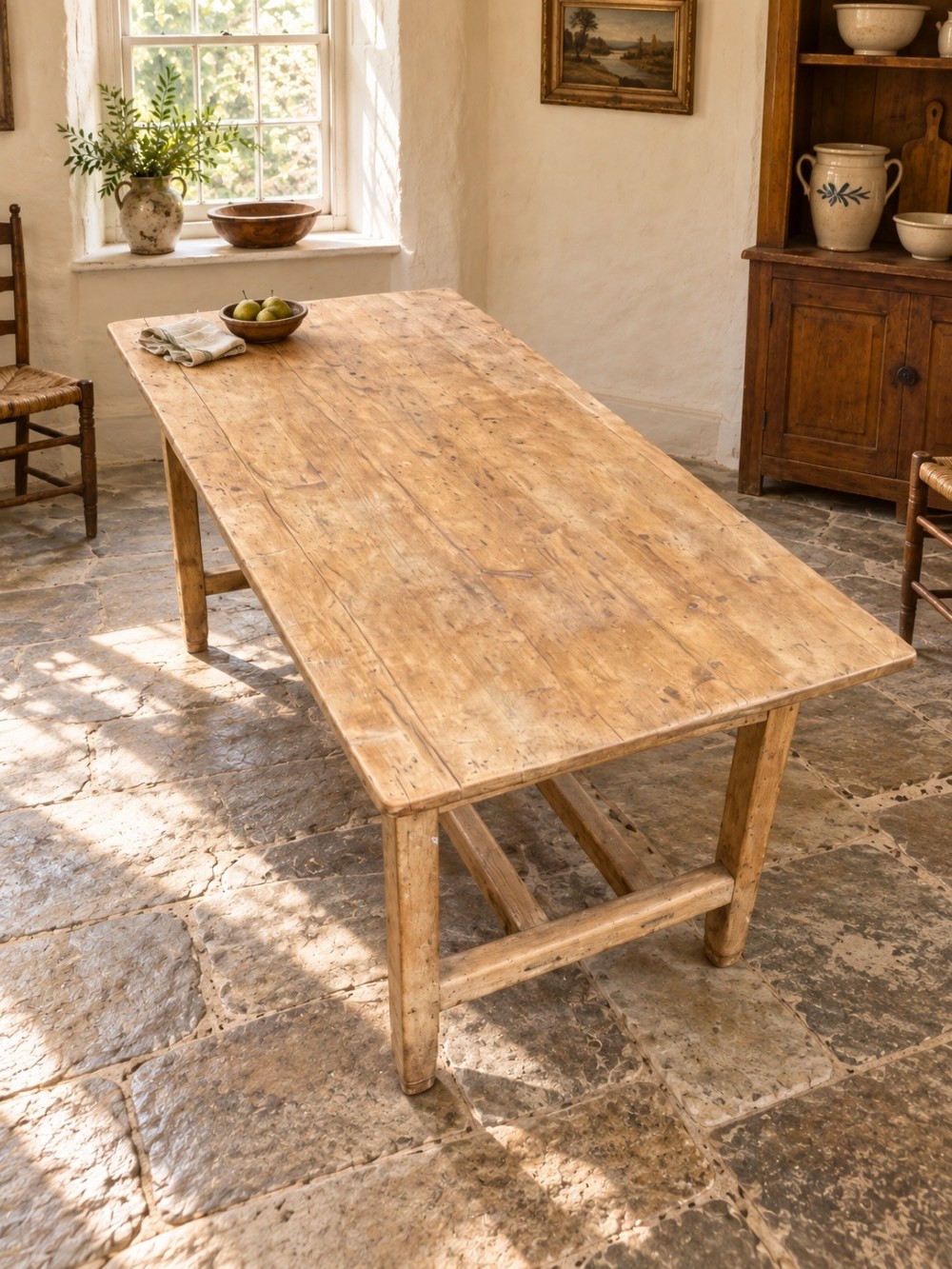 A 19th century rectangular Irish pine farmhouse table featuring square legs, lower H-stretchers, and a warm timber finish. View III