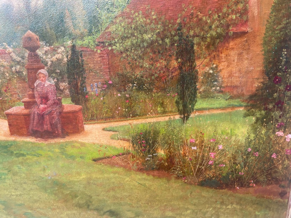 An antique oil painting depicting a woman seated in a walled garden surrounded by trees and a country house, set in an ornate gilded frame. View XII