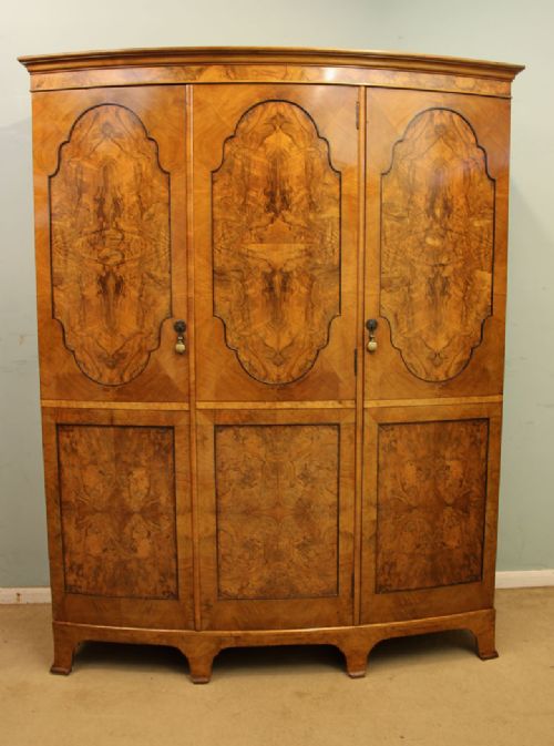 Burr Walnut Bow Front Triple Wardrobe.