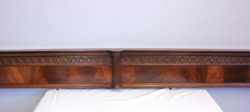 fig 1. A long antique flame mahogany architectural pediment featuring a geometric carved frieze and fluted end pilasters.