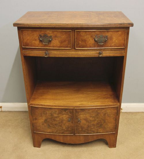 A pair of antique burr walnut bedside cabinets featuring top drawers, pull-out slides, open middle shelves, and double-door lower cupboards. View III