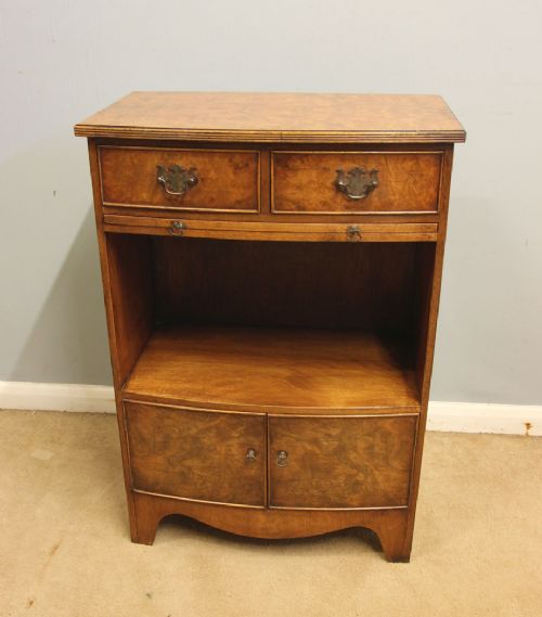 A pair of antique burr walnut bedside cabinets featuring top drawers, pull-out slides, open middle shelves, and double-door lower cupboards. View XII