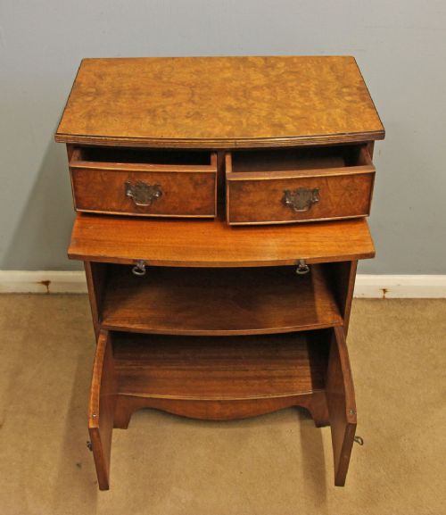 A pair of antique burr walnut bedside cabinets featuring top drawers, pull-out slides, open middle shelves, and double-door lower cupboards. View XIII