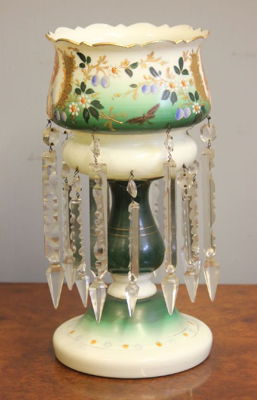 A Victorian opaque white and green glass mantle lustre featuring a hand-painted portrait vignette of a child, floral enamel accents, and suspended crystal prisms. View VI