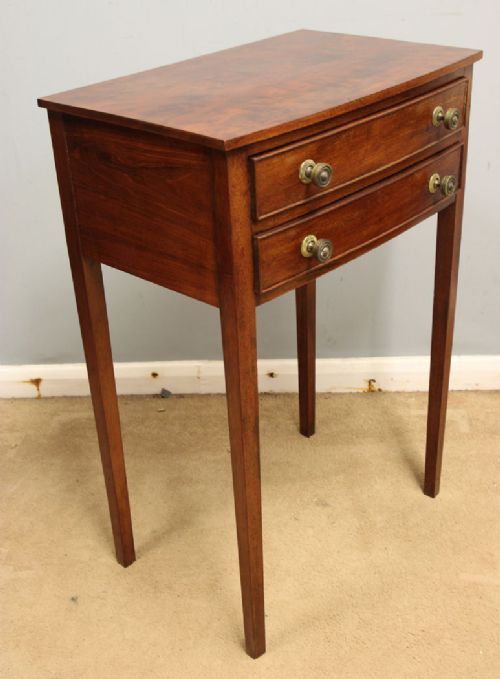 A pair of slim mahogany bedside tables, each featuring two drawers with brass knobs and tall square tapered legs. View IV